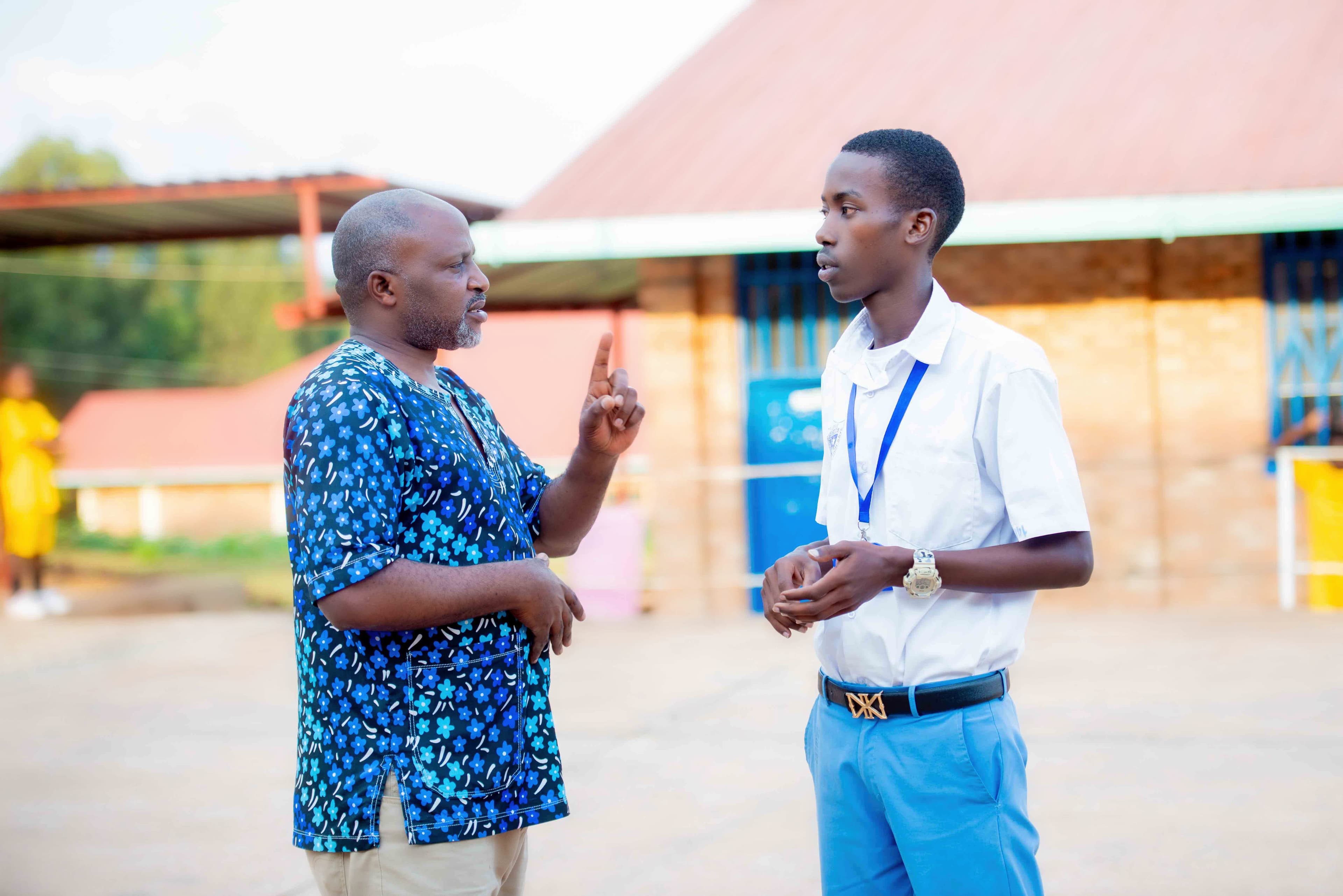 A teacher walking with students, offering advice or sharing a laugh.