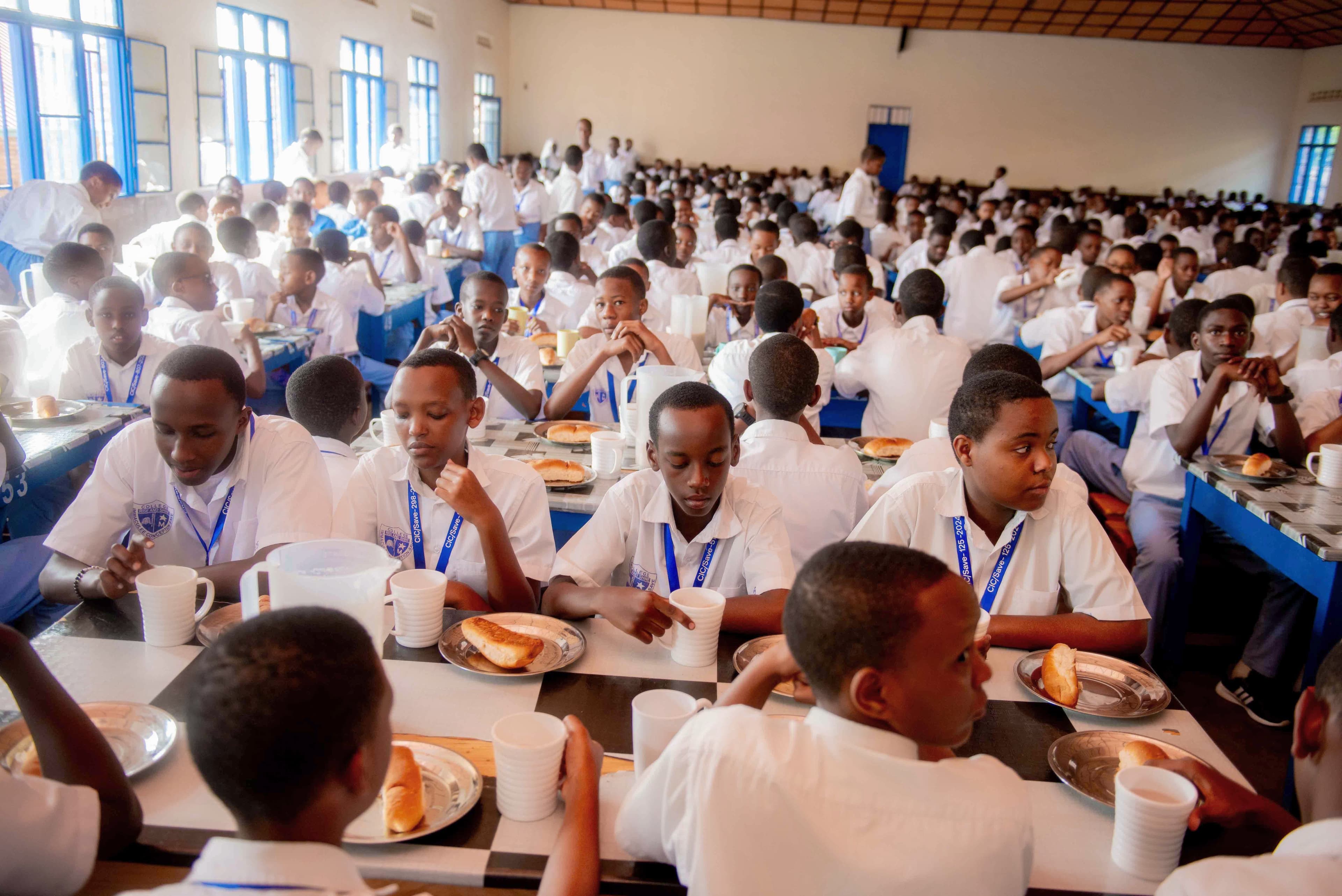 Dormitory scenes: students making beds, chatting, or sharing meals.